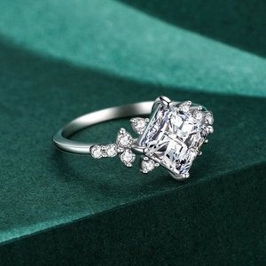 S925 sterling silver ring with princess cut cubic zirconia on green velvet