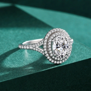 Luxurious S925 sterling silver ring featuring a 5-carat oval cubic zirconia and halo setting