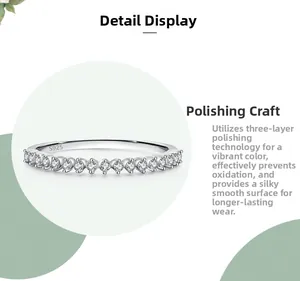 Macro detail showing S925 sterling silver stamp and polished finish on the paved ring