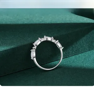 Detail of five marquise-cut white gemstones in claw setting on a silver ring
