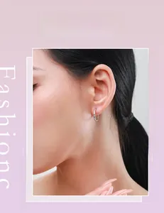 Model wearing minimalist s925 sterling silver micro-set hoop earrings in a modern style