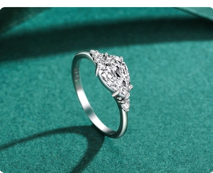 Macro shot of S925 sterling silver stamp and pear-cut zircon on the polished ring