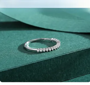 Macro shot of 925 sterling silver half eternity ring with brilliant round cut zircons