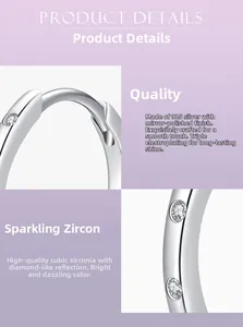 Macro detail of 925 sterling silver hoop earrings with micro-paved cubic zirconia stones