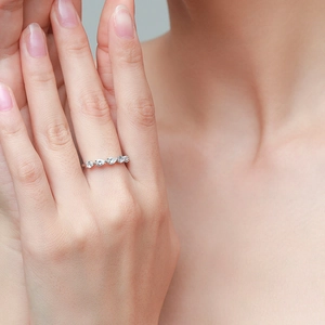 Elegant S925 silver ring featuring five drop-shaped white gemstones on model's finger