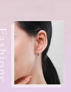 Close-up of minimalist S925 sterling silver hoop earrings with fine micro-set zircons