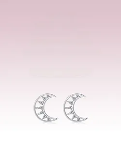 Close-up of S925 silver crescent moon stud earrings with sparkling zircon inlay detail