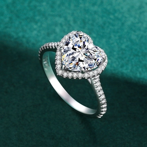 Luxury S925 sterling silver halo ring with heart-shaped diamond on green velvet