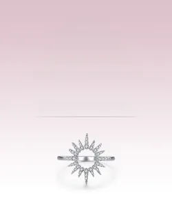 Macro view showing the sparkling zircon sunflower ring detail and silver starburst texture