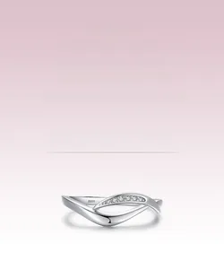 Macro shot of S925 sterling silver stamp on a minimalist cross ring with micro-set diamonds