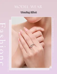 Macro detail of s925 silver criss-cross ring with micro-pave cubic zirconia on model's hand