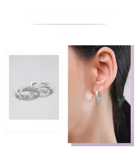 Close-up of S925 silver hoop earrings featuring irregular cubic zirconia stones