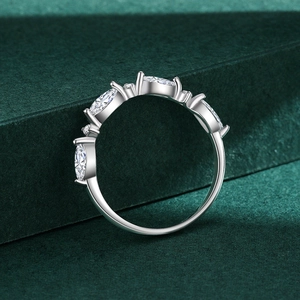 Elegant s925 silver marquise and round cut cluster ring on a premium green pedestal