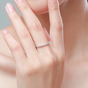 S925 sterling silver minimalist eternity ring with clear zircon stones on a female finger