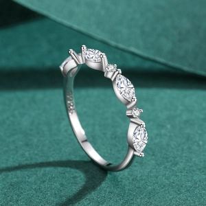 S925 sterling silver marquise and round zircon ring on textured green fabric