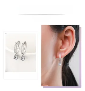 Detail of S925 sterling silver hoop earrings with round cut sparkling cubic zirconia