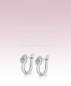 Macro detail of S925 sterling silver stamp on pear-shaped teardrop cubic zirconia earrings