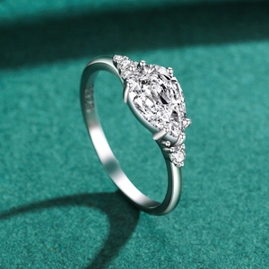 Elegant S925 sterling silver pear cut zircon ring on dark green velvet background