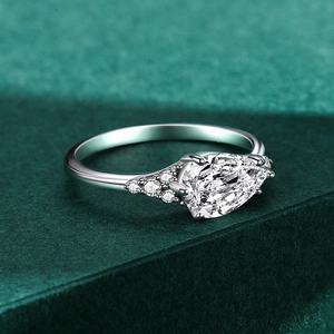 Minimalist S925 sterling silver ring with pear-shaped cubic zirconia and side stones