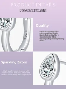 Macro shot showing S925 hallmark and teardrop cubic zirconia on silver earring