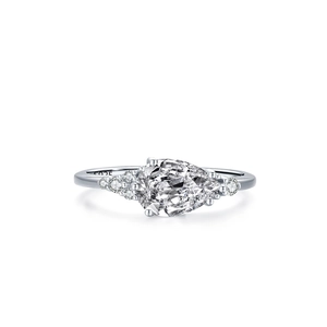 Elegant S925 sterling silver ring featuring a pear-shaped zircon and side stones on white base