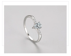 Macro shot of S925 silver ring featuring a pear-shaped cubic zirconia and V-shaped band