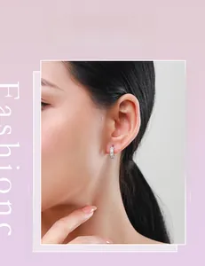 Close-up of elegant S925 sterling silver hoop earrings with rectangular cubic zirconia