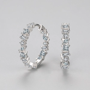 Elegant S925 sterling silver hoop earrings with irregular zircon stones on grey background