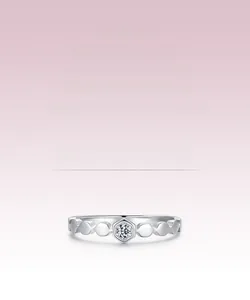 Detailed macro view of silver honeycomb ring band with central hexagonal set gemstone