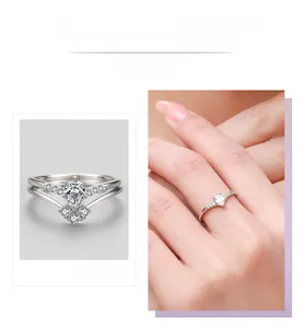 Detail view showing a pear-shaped diamond engagement ring with silver stacking V-band
