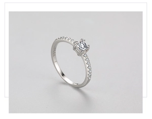 Close-up of S925 sterling silver stamp and princess cut square cubic zirconia on ring