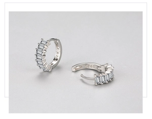 Macro shot of S925 sterling silver hoop earrings with rectangular zircon channel setting