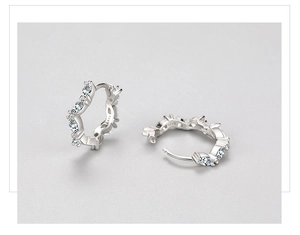 Detailed macro view of S925 sterling silver hoop earrings with marquise-cut zircons