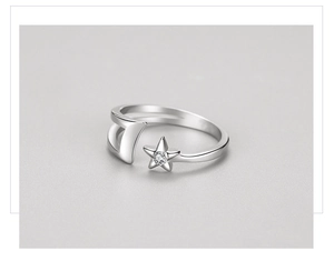 Close-up of S925 sterling silver moon and star open ring with sparkling cubic zirconia