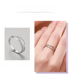 Detail view of intertwined S925 silver double rings with micro-pave cubic zirconia