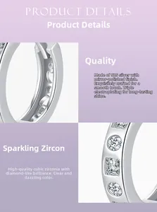 Detail of 925 sterling silver hoop earrings with zirconia and heart-shaped hollows