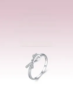 Detailed close-up of S925 sterling silver bow ring featuring micro-pave cubic zirconia