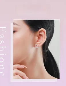 Detail view of s925 silver sunflower stud earrings with sparkling diamonds on female model
