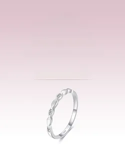 Macro detail of S925 sterling silver ring with small stones and leaf geometric design