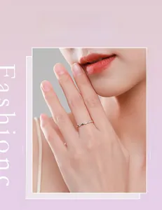 Detail of twisted S925 sterling silver ring with micro-pave diamonds on model finger
