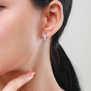S925 sterling silver hoop earrings with rectangular zircon stones worn by a model