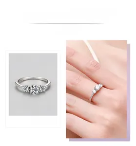 Detailed close-up of S925 silver three-stone zircon ring with side pavé setting and hand view