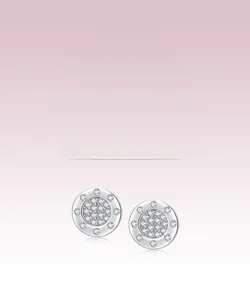 Macro detail of S925 sterling silver round stud earrings featuring micro-pave zircon crystals
