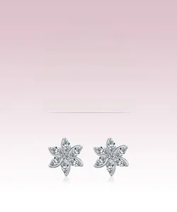 Detailed macro shot of S925 sterling silver flower earrings with marquise-cut zircons