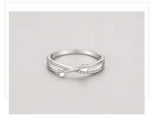 Macro shot of S925 sterling silver ring with double layers, heart motifs and cubic zirconia