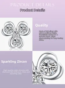 Macro view of polished s925 silver stud earring with three-petal zircon flower design