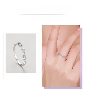 Macro detail of S925 sterling silver ring showing infinity design with micro-inlaid zircon stones