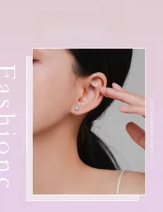 Close-up of model wearing round s925 silver stud earrings with micro-pave crystals