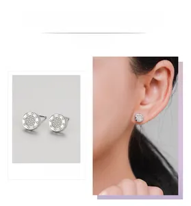 Detail of round S925 sterling silver stud earrings with micro-pave white zircon stones