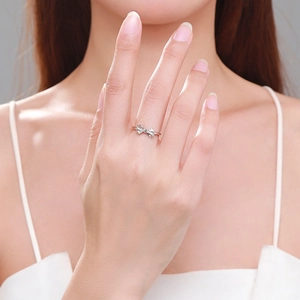 S925 sterling silver bow ring with sparkling zircons worn on a finger for daily wear